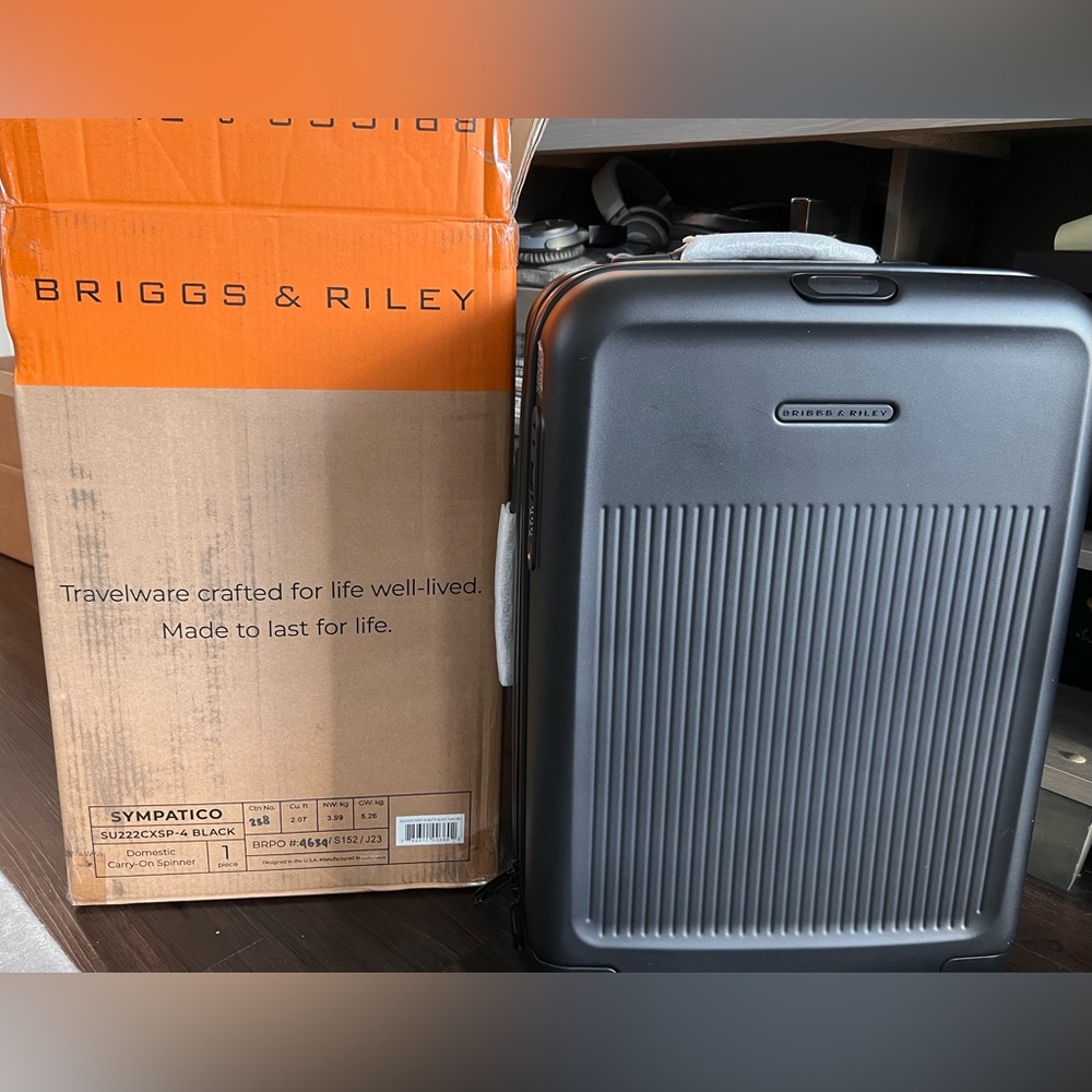 Brand new in box. Briggs and Riley carry-on sympatico 22”
